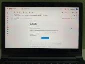 Photo of Gmail (on laptop) to G Suite administrator: "You have an admin alert about Phishing message detected post-delivery that requires your attention. Please view alert details in G Suite Alert Center."