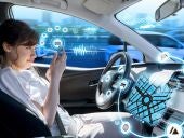 young woman using a smart phone in a autonomous car. driverless car. self driving vehicle. heads up display. automotive technology.