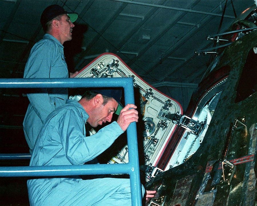 jack-swigert-left-and-jim-lovell-examine-the-command-module-aboard-the-iwo-jima.jpg