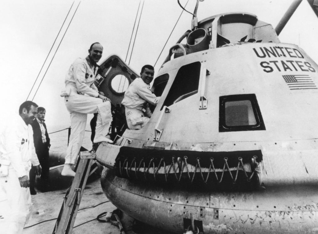 jim-lovell-left-ken-mattingly-and-fred-haise-climb-into-a-command-module.jpg