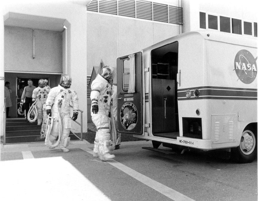 the-apollo-13-crewmembers-make-their-way-to-the-transfer-van.jpg
