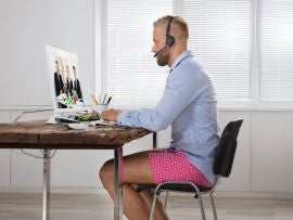 Businessman Attending Video Conference On Computer