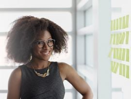 Portrait of a smiling business woman with an afro in