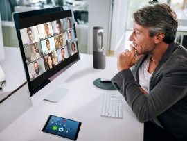 A man on a Zoom call with colleagues