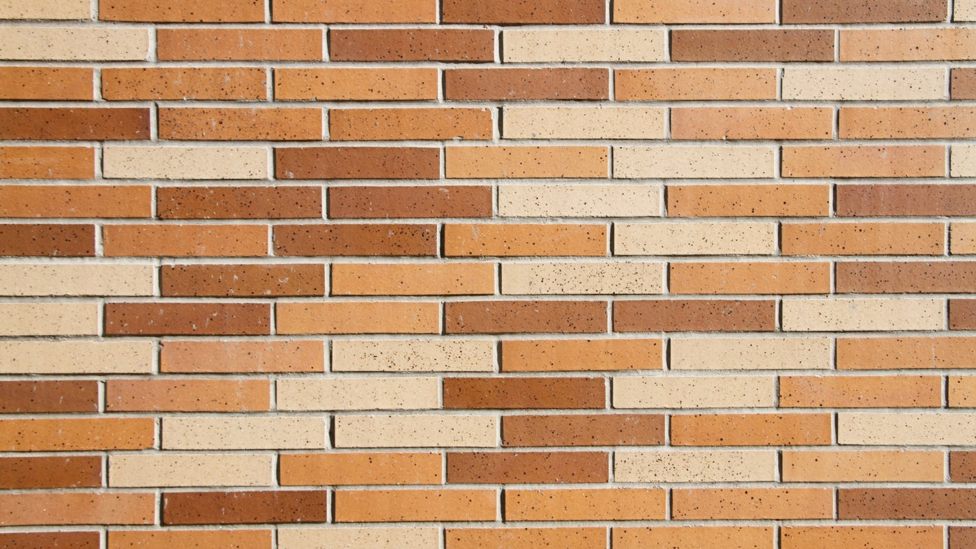 Orange and brown brick wall virtual background.