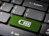 A keyboard with a battery warning on it.