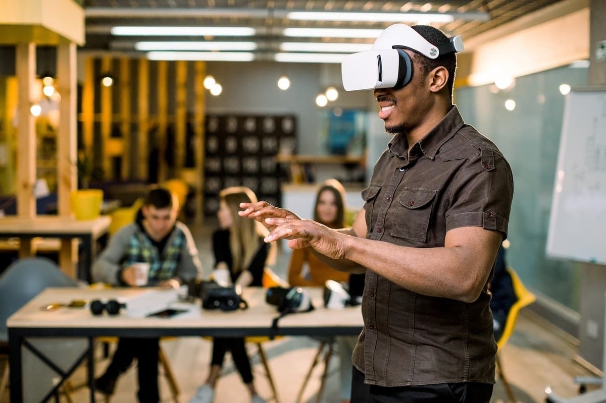 Black man using virtual reality glasses