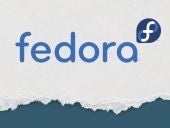 Fedora logo on torn paper background