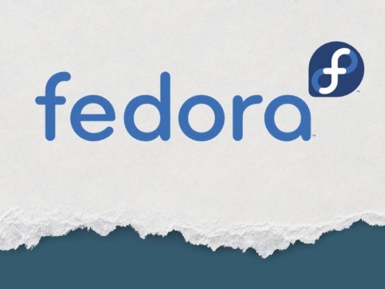 Fedora logo on torn paper background