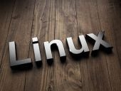 Linux written in silver on a wooden background