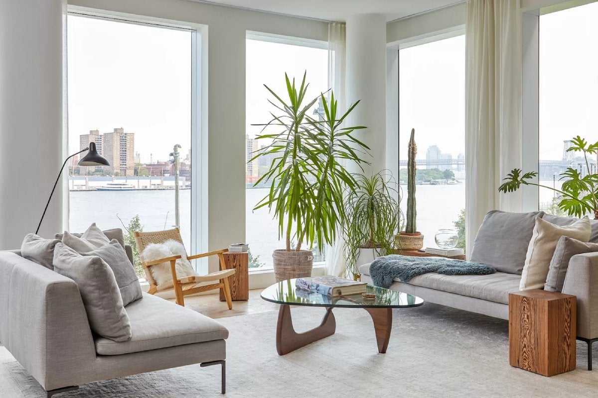 A minimalist living room with an urban view.