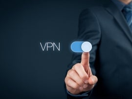 A hand sliding a VPN button on.
