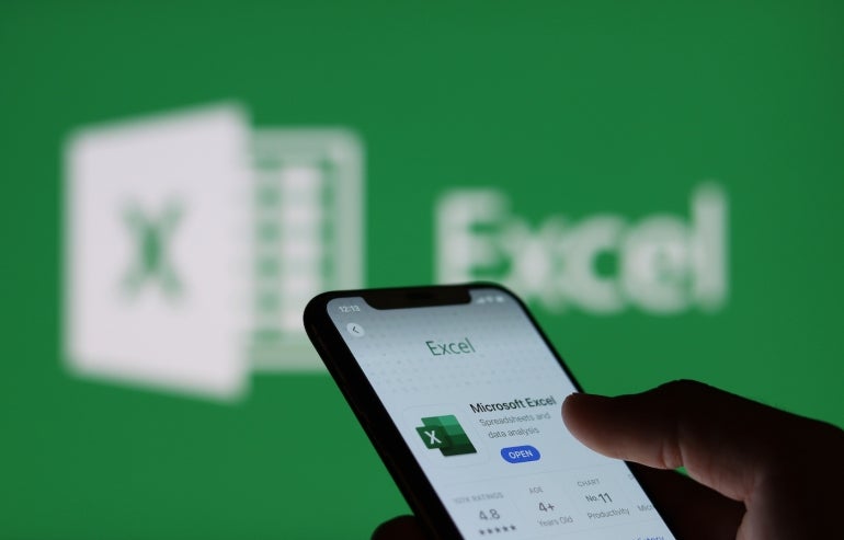Microsoft excel on smartphone screen and Microsoft excel logo background : Chiang Mai, Thailand, January 9, 2022