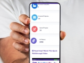 mobile phone being help up with EmailWritr app open