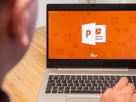 PowerPoint is used by a man on the laptop. Microsoft customer used computer software. New product is tested by IT specialist. San Francisco, February 2020.