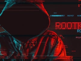 Rootkit concept with faceless hooded male person, low key red and blue lit image and digital glitch effect