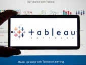 Tableau application and logo on android cellphone over a chart.