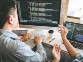 man programming on a computer