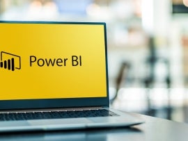 Laptop computer displaying logo of Microsoft Power BI.