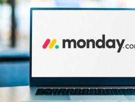 Laptop computer displaying logo of monday.com