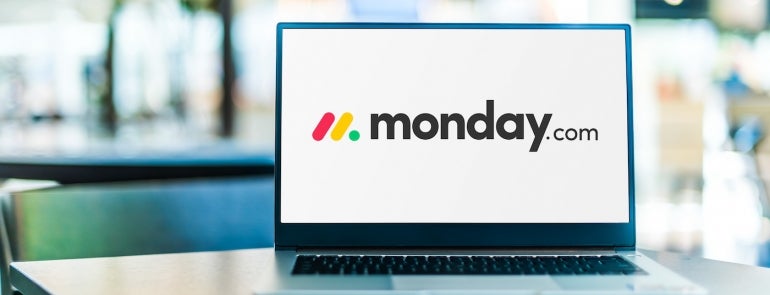 Laptop computer displaying logo of monday.com