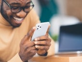 African-American businessman holding Apple iPhone 11 Pro Max