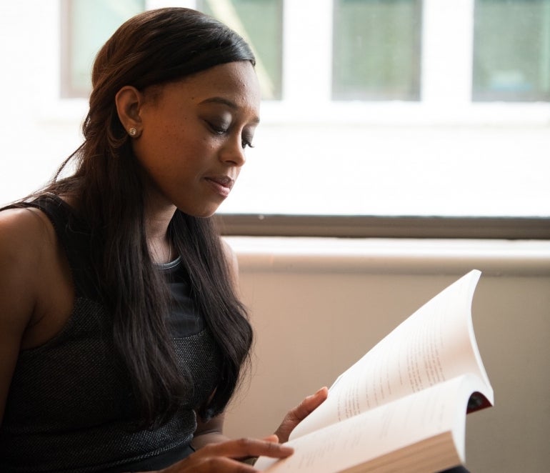 Person reading a book.