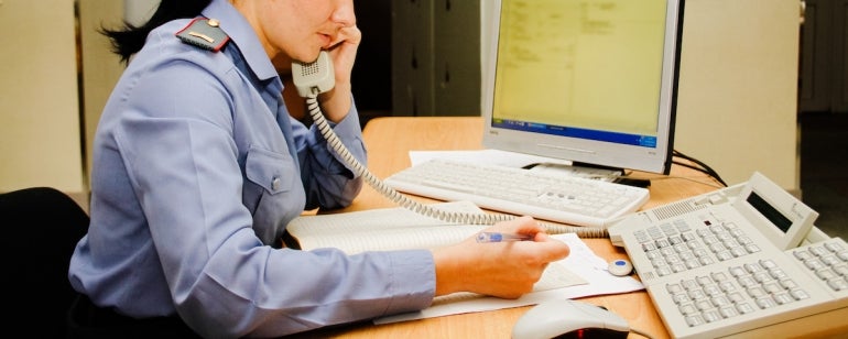 police station worker on computer