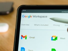 Google Workspace logo shown by apple pencil on the iPad Pro tablet screen. Man using application on the tablet. December 2020, San Francisco, USA.