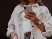A person holding an iPhone.