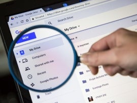 A magnifying glass held over the Google Drive toolbar.