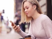 A woman looking at a cellphone