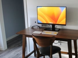 A macbook running macOS ventura on a table.