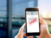 A person receiving a fraud BEC message via SMS.