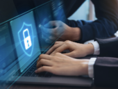 A cybersecurity professional works on a computer.
