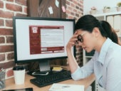 woman finding computer getting virus attack
