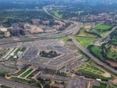 Aerial view of the United States Pentagon, the Department of Defense headquarters in Arlington, Virginia, near Washington DC, with I-395 freeway and the Air Force Memorial and Arlington Cemetery nearb