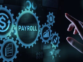 A hand reaching towards a digital sign that says payroll.