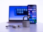 Laptop and smartphone with locked and unlocked padlock