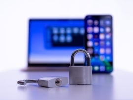 Laptop and smartphone with locked and unlocked padlock