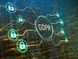The word GDPR and data protection symbols on an abstract background.