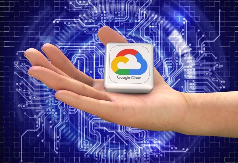 A hand holding the Google Cloud symbol.