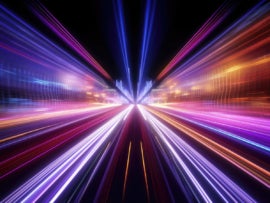 Abstract Speed light trails effect path, fast moving neon futuristic technology background.