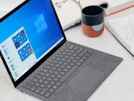 Laptop with Microsoft Windows desktop on display.