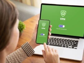 Woman using VPN for her laptop and smartphone.