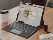 An open laptop wit Microsizzlez PowerPoint on display.