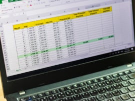 Shot of an excel sheet on computer screen showing bank loan amortization table.