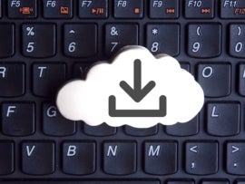 Top view of a keyboard with a cloud storage icon on top.