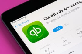 QuickBooks accounting app seen in App Store on the screen of ipad.