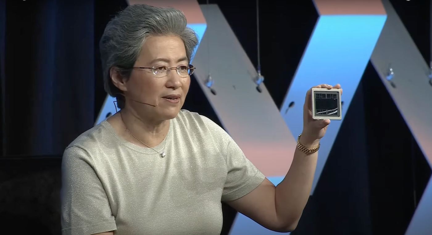 AMD CEO Lisa Su holds up a MI300 AI accelerator chip at SXSW in Austin, Texas on March 11.
